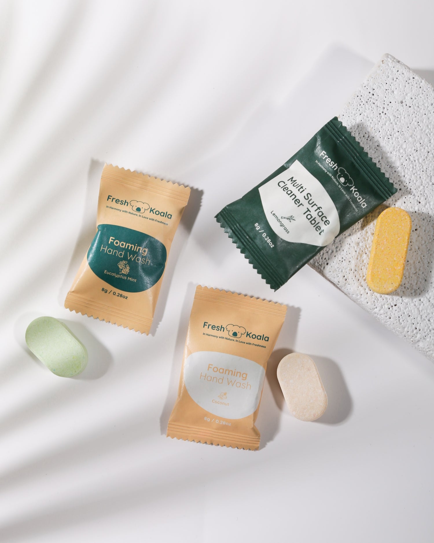 Fresh Koala cleaning tablets and its eco-friendly, plastic-free packaging shown side by side